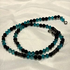 Dark turquoise and black gemstone beaded necklace.